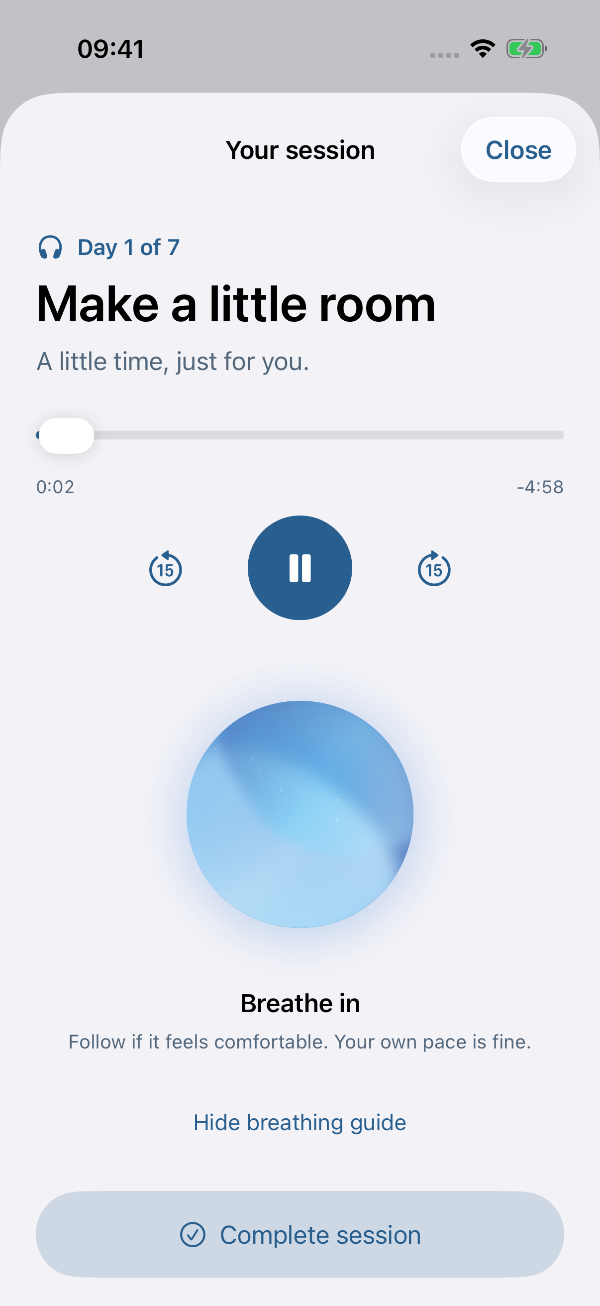 The current iPhone audio player with its blue breathing globe and playback controls.
